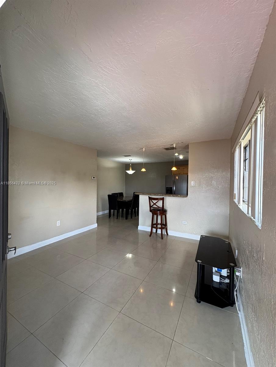 3480 Northwest 208th Street Miami Gardens, FL 33056 - Photo 3 of 7 a car parked in parking area