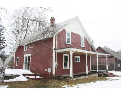 283 Number 9 Road Heath, MA 01367 - Photo 1 of 16 a view of a house with a yard covered in snow