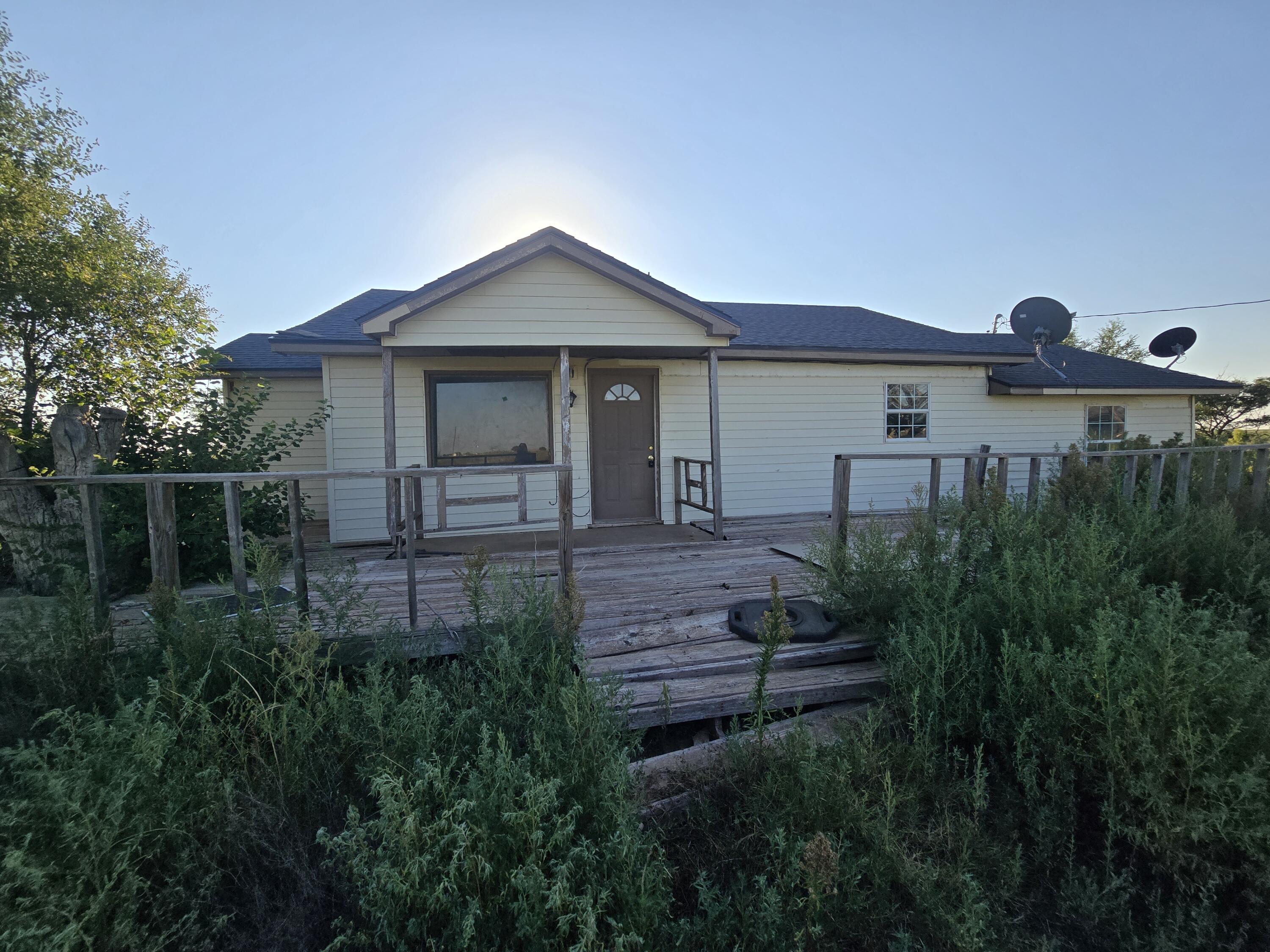 a front view of a house with yard
