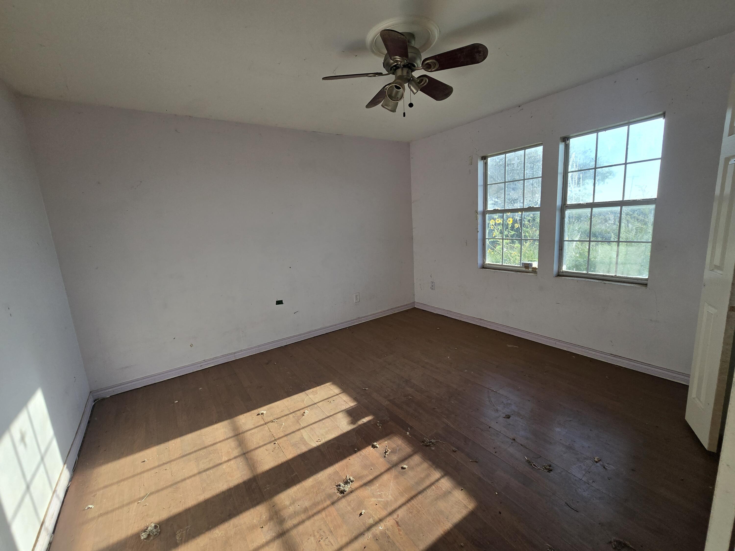 1611 County Road 50 Plainview, TX 79072 - Photo 5 of 11 a view of an empty room and window