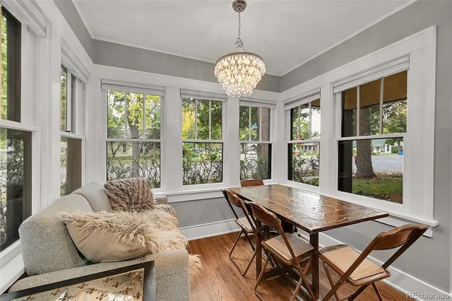a view of a dining room with furniture window and outside view