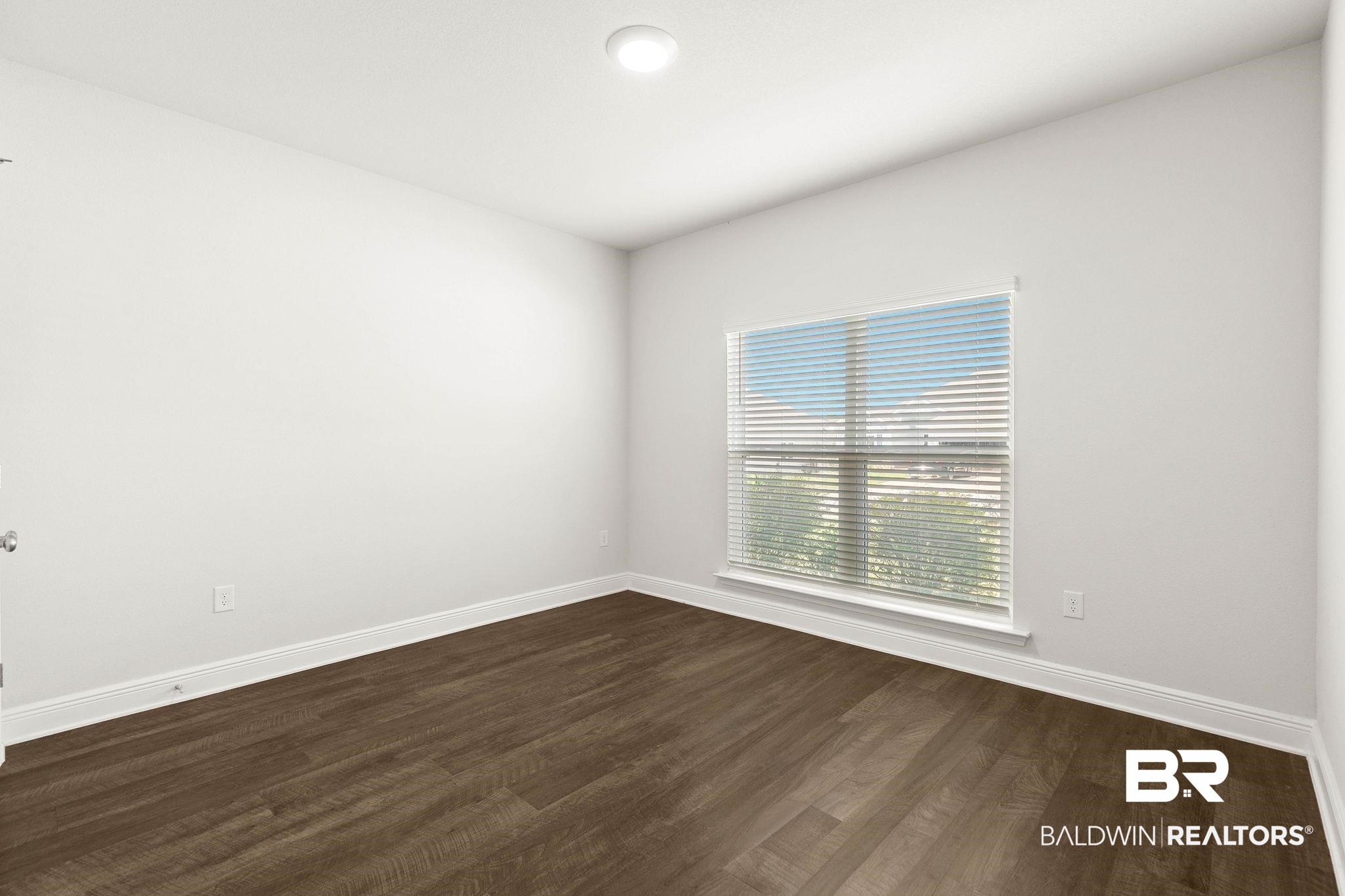 9448 Amethyst Drive Daphne, AL 36526 - Photo 31 of 61 Unfurnished room featuring baseboards and dark wood finished floors