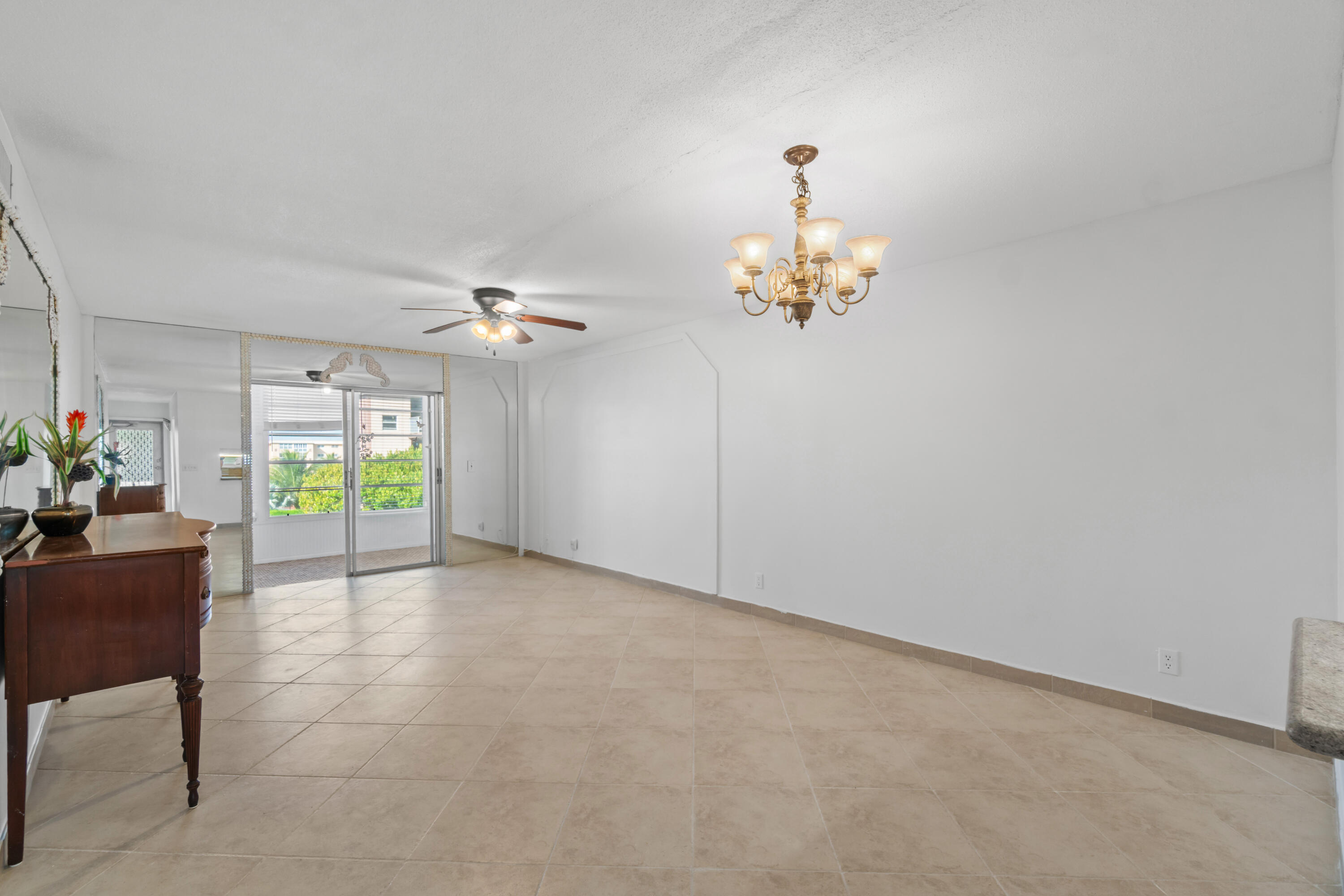 2615 Northeast 1st Court, Unit 303 Boynton Beach, FL 33435 - Photo 18 of 44 a view of a chandelier in a room