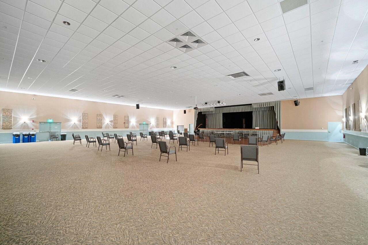 2615 Northeast 1st Court, Unit 303 Boynton Beach, FL 33435 - Photo 42 of 44 a room with lots of table and chairs