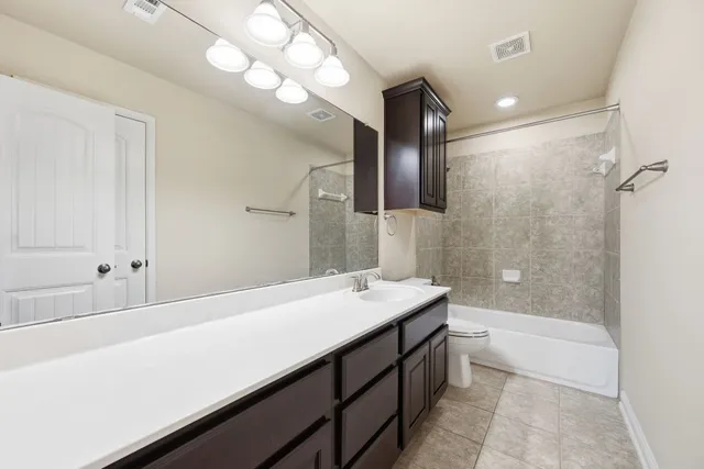 a bathroom with a sink a mirror and a bathtub