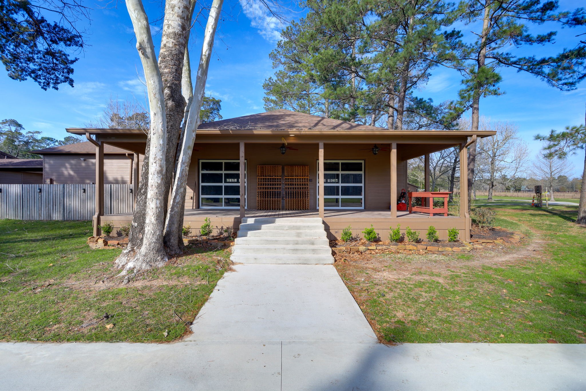 10210 Stidham Road Conroe, TX 77302 - Photo 31 of 39 a front view of a house with a yard