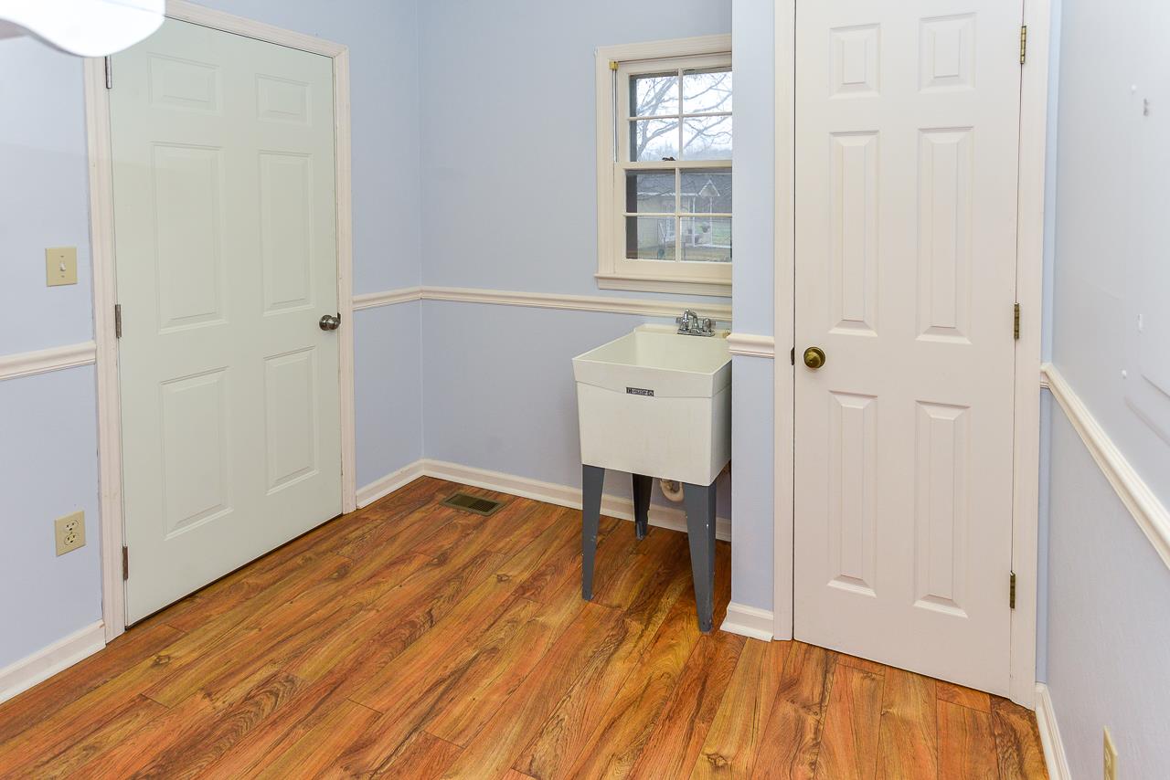 3018 Bobo Section Road Hazel Green, AL 35750 - Photo 18 of 30 The Laundry Room has a sink and extra storage!