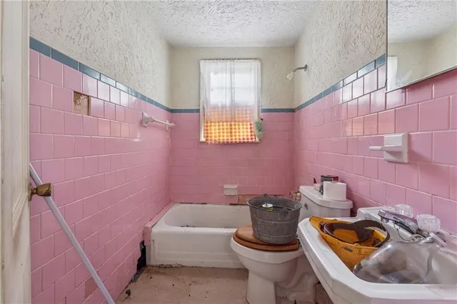 a utility room with a sink a washer and dryer