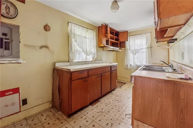 a view of a bathroom with a glass shower door