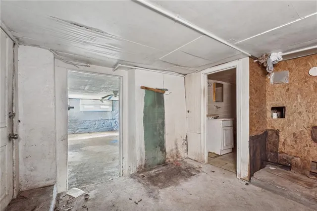 a bathroom with a granite countertop toilet a sink and a mirror