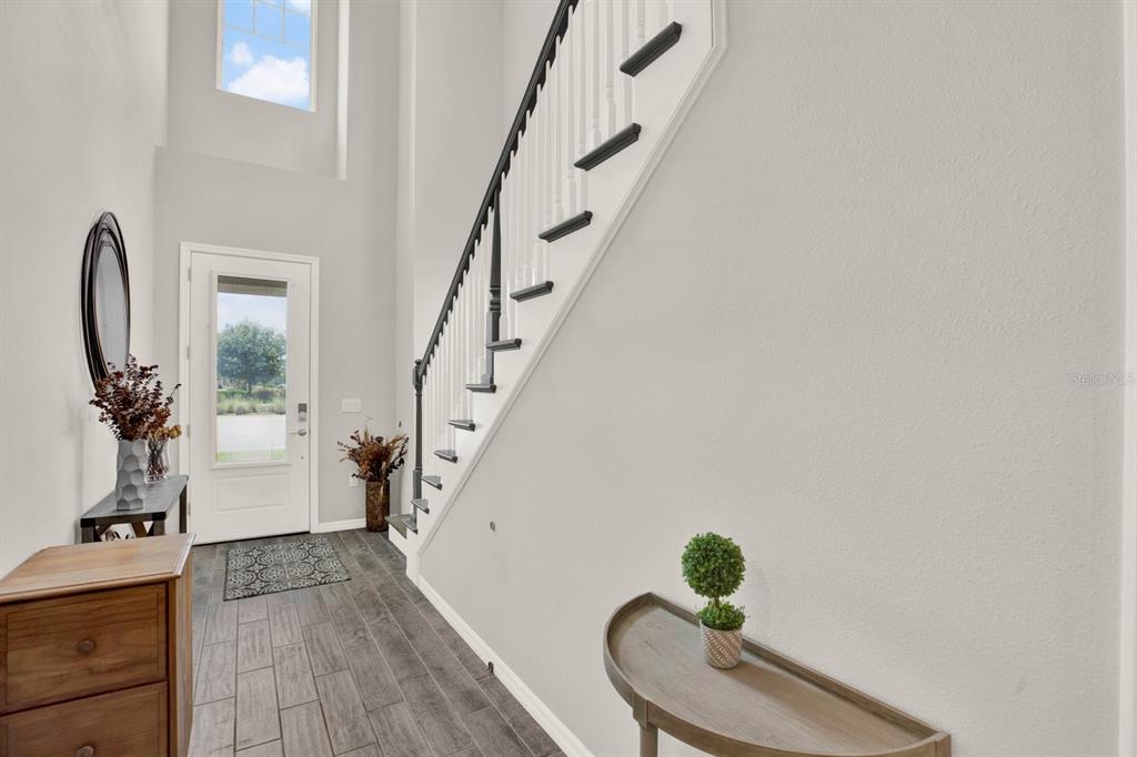 13729 Rangeland Boulevard Odessa, FL 33556 - Photo 4 of 30 a view of entryway with wooden floor