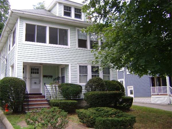 23-25 Channing Road Watertown, MA 02472 - Photo 2 of 12 a front view of a house with a yard