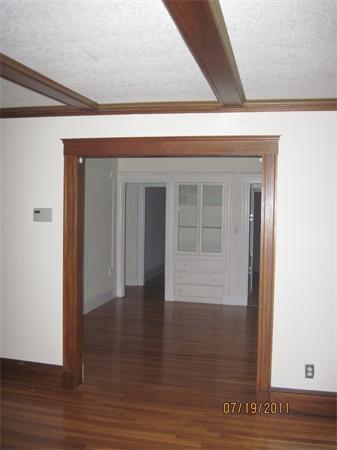 23-25 Channing Road Watertown, MA 02472 - Photo 6 of 12 a view of a hallway with wooden floor