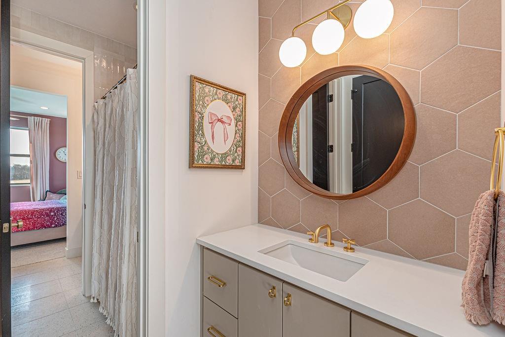 2396 County Road 2145 Cooper, TX 75432 - Photo 31 of 40 a bathroom with a sink and a mirror