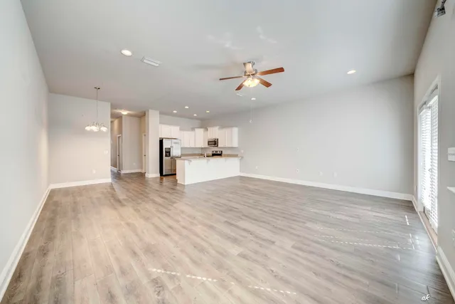 a view of a kitchen with a dishwasher and a window