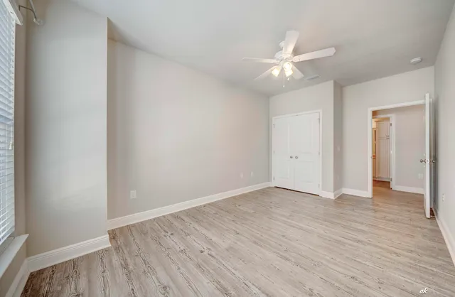 a bathroom with a granite countertop sink a toilet and a bathtub