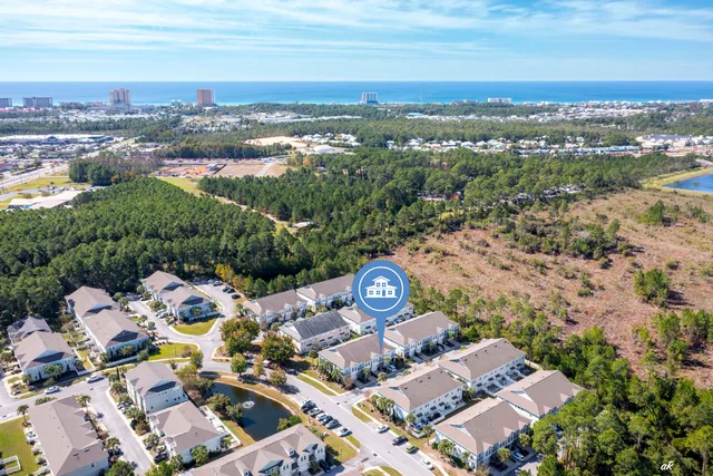 an aerial view of a city with ocean view