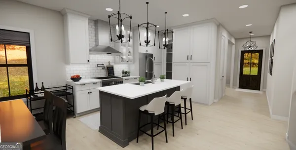 a kitchen with stainless steel appliances kitchen island a table chairs in it and wooden floors