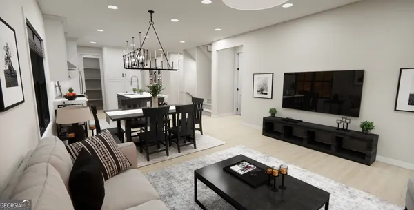 a living room with furniture flat screen tv and a chandelier
