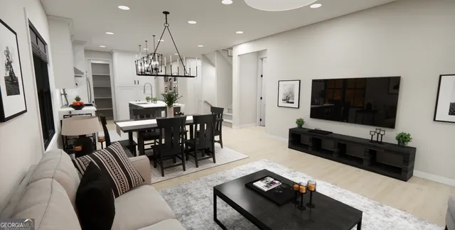 a living room with furniture flat screen tv and a chandelier