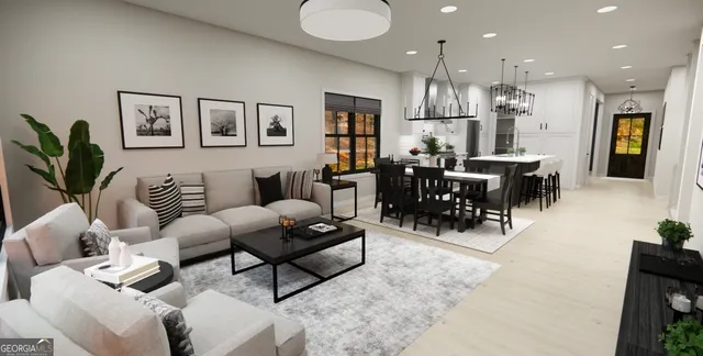 a living room with lots of furniture and a dining table with kitchen view
