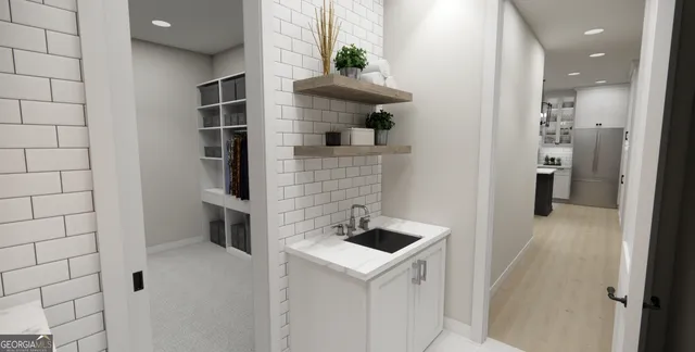a bathroom with a sink and mirror