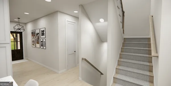 a view of entryway with lots of frames and shower