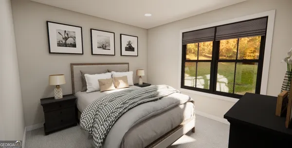 a bedroom with a large bed and a large window