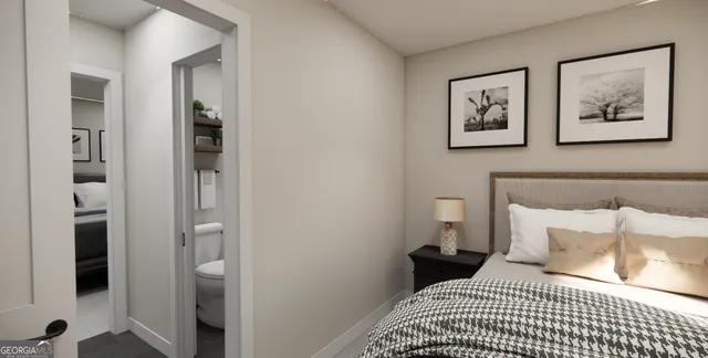 a bedroom with a bed and a lamp