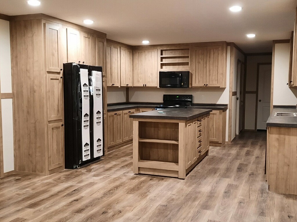 351 Calvert Ridge Road Westmoreland, TN 37186 - Photo 6 of 31 a kitchen with stainless steel appliances granite countertop a stove a refrigerator and a microwave