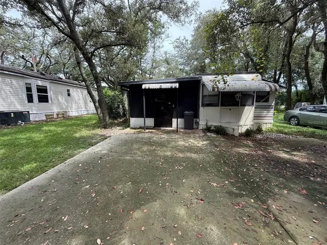 a view of a house with a back yard