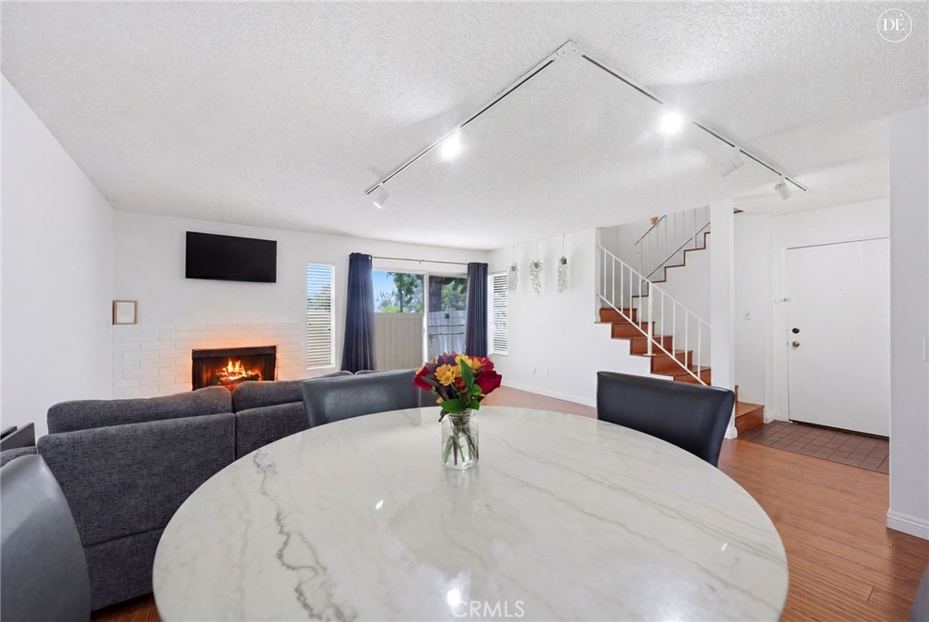 23721 Highland Valley Road Diamond Bar, CA 91765 - Photo 6 of 60 Glowing fireplace (Disclaimer: Some images have been digitally enhanced to illustrate potential room layouts and furnishings. Actual property condition and features may vary. Buyer to verify all information independently).