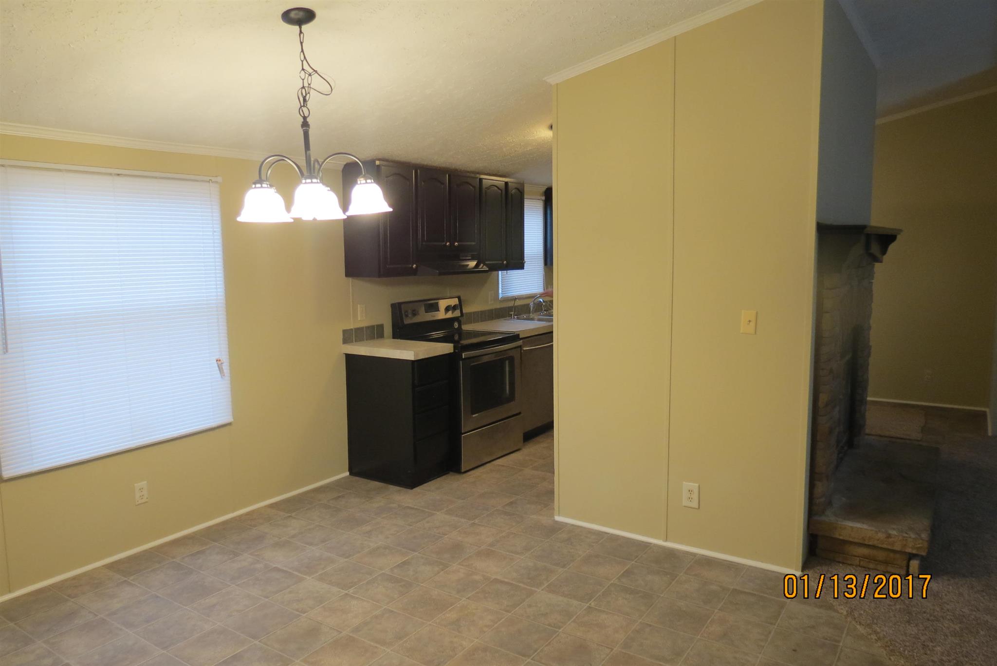 898 Bell Road Watertown, TN 37184 - Photo 11 of 23 a kitchen with stainless steel appliances granite countertop a sink a refrigerator and a stove