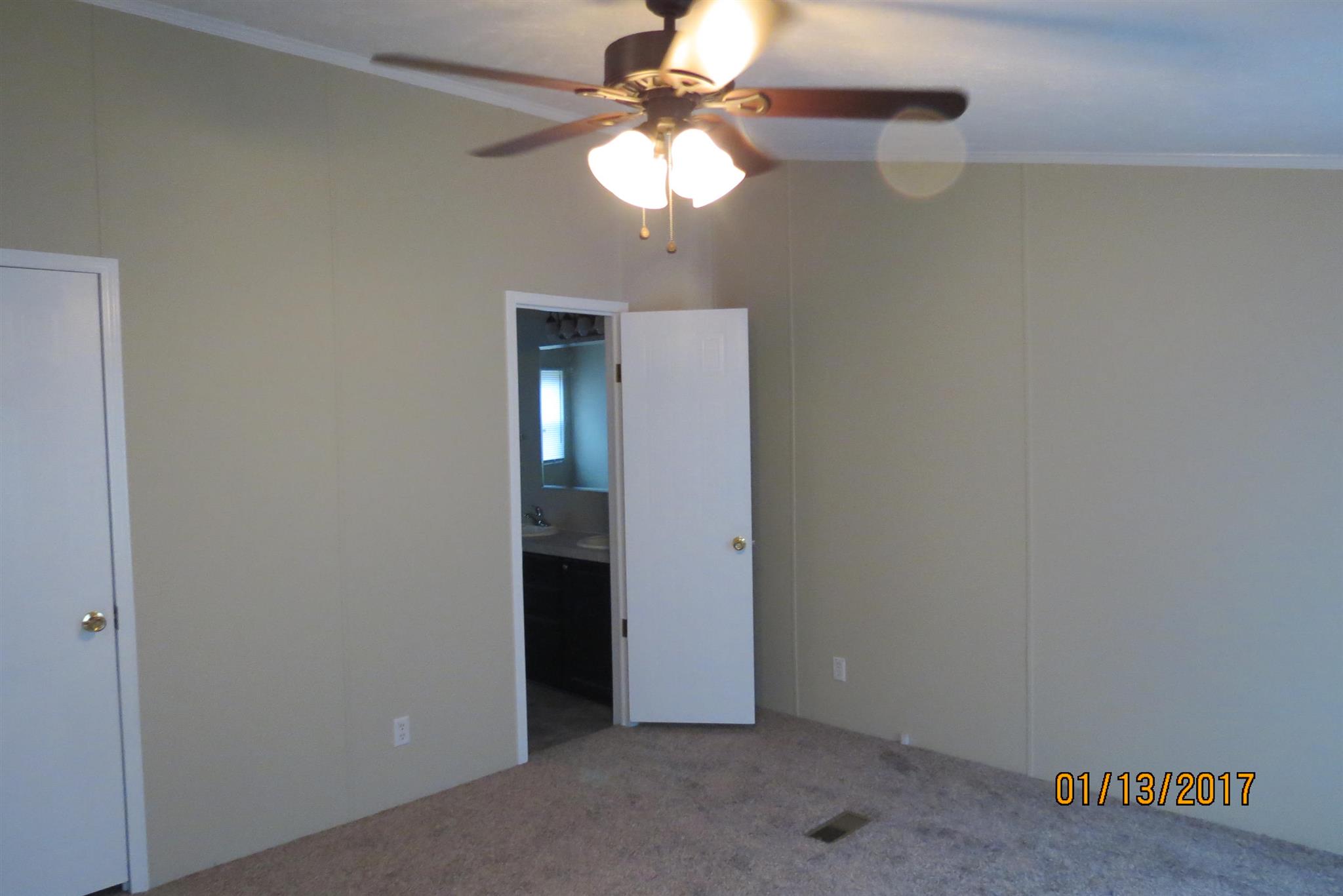 898 Bell Road Watertown, TN 37184 - Photo 14 of 23 an empty room with a chandelier fan and a chandelier fan