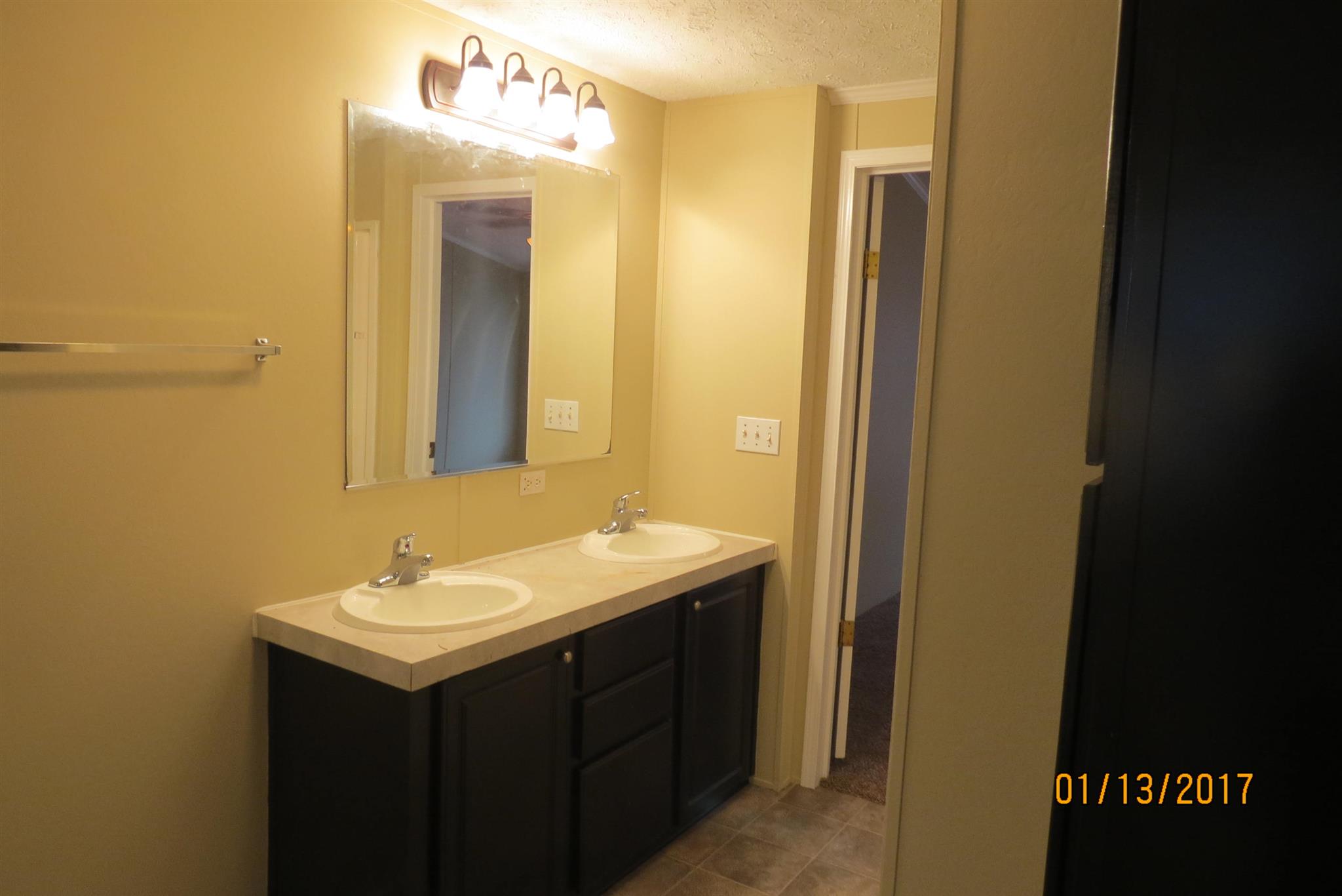 898 Bell Road Watertown, TN 37184 - Photo 15 of 23 a bathroom with a sink and a mirror