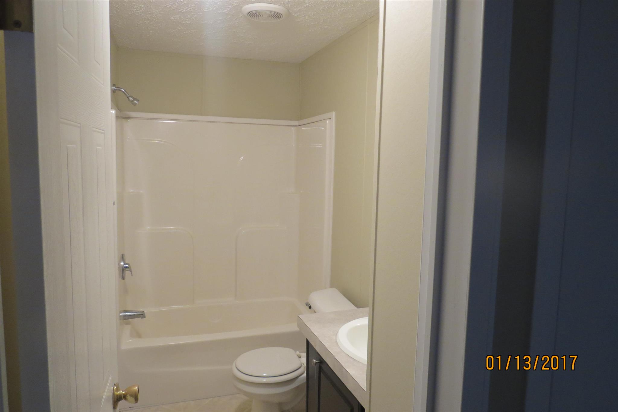 898 Bell Road Watertown, TN 37184 - Photo 18 of 23 a bathroom with a granite countertop bathtub shower sink vanity and toilet