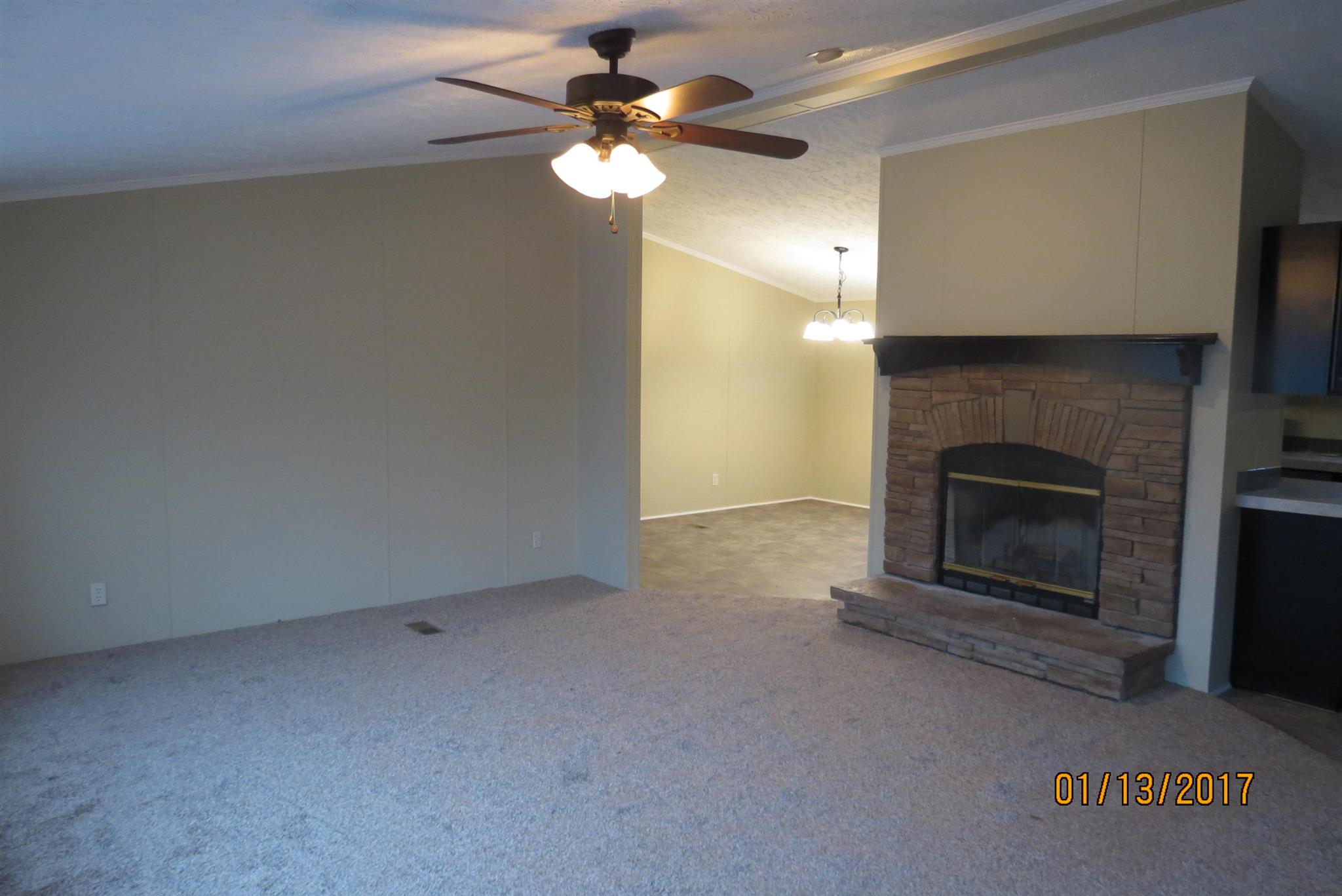 898 Bell Road Watertown, TN 37184 - Photo 2 of 23 an empty room with a fireplace