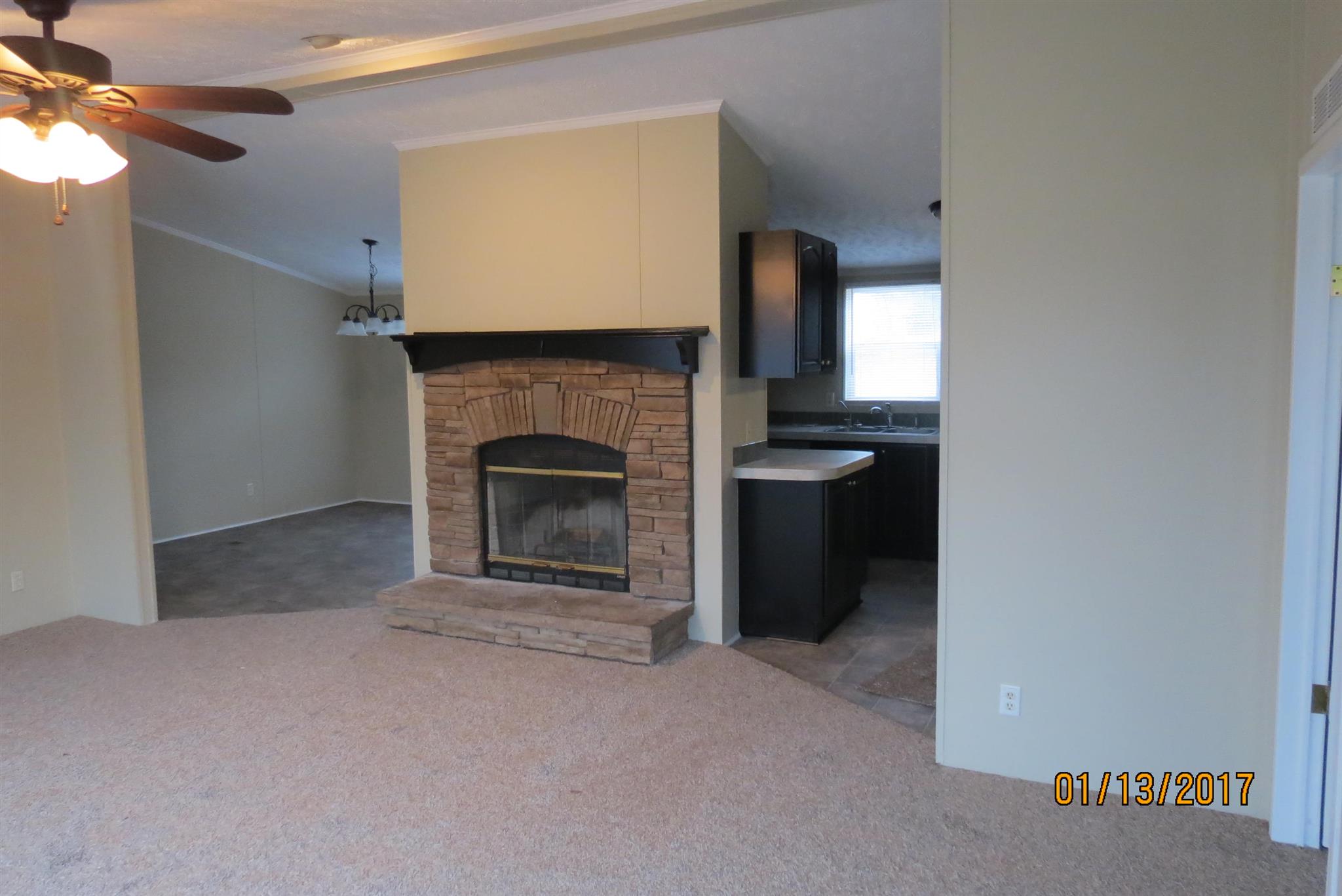 898 Bell Road Watertown, TN 37184 - Photo 3 of 23 a view of an empty room with a fireplace and a window