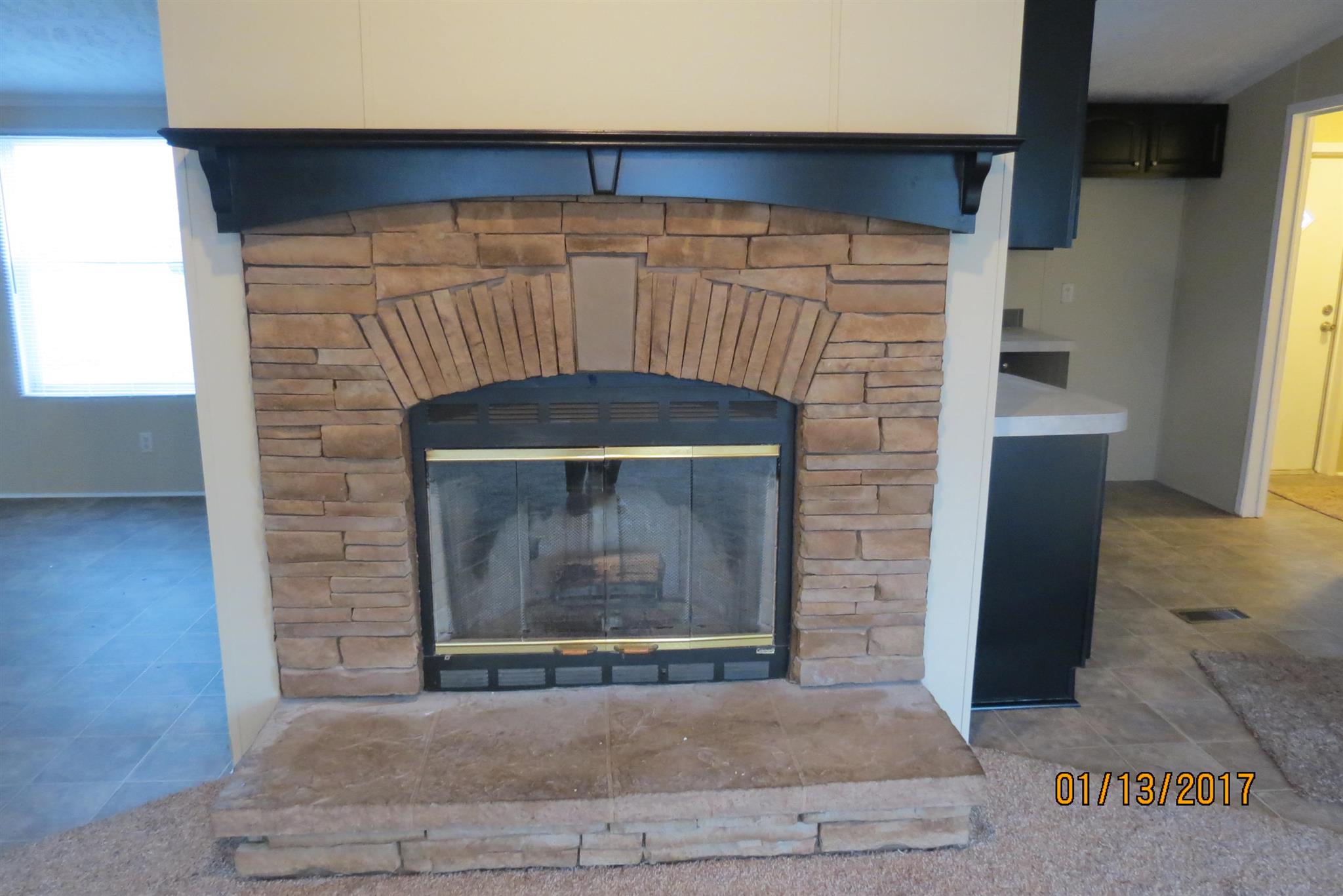 898 Bell Road Watertown, TN 37184 - Photo 4 of 23 a stone fireplace with two windows