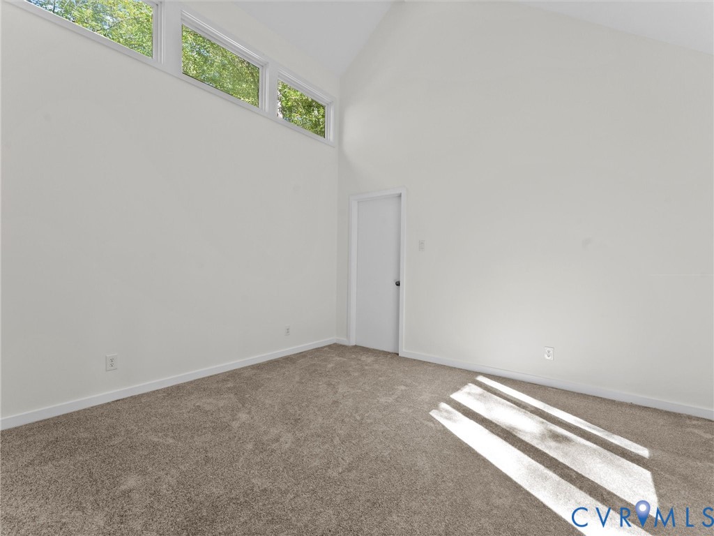 3601 Quail Meadows Place Midlothian, VA 23112 - Photo 8 of 27 Carpeted spare room with high vaulted ceiling and