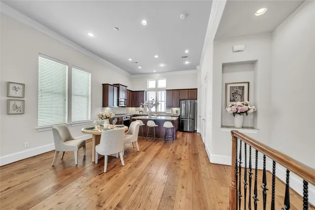 a view of a dining room with furniture window and wooden floor