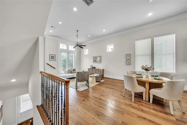 a view of a dining room with furniture window and wooden floor