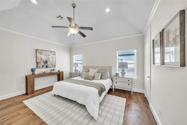 a room with a bed and a chandelier