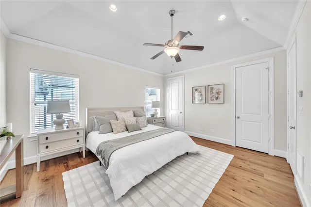 a bedroom with a large bed and a window