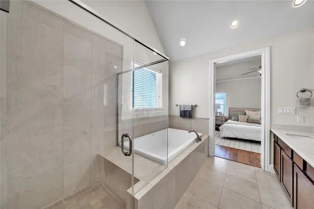 a en suite bathroom with a tub and window