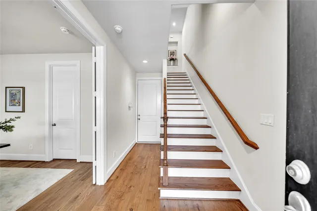 a view of entryway with wooden floor