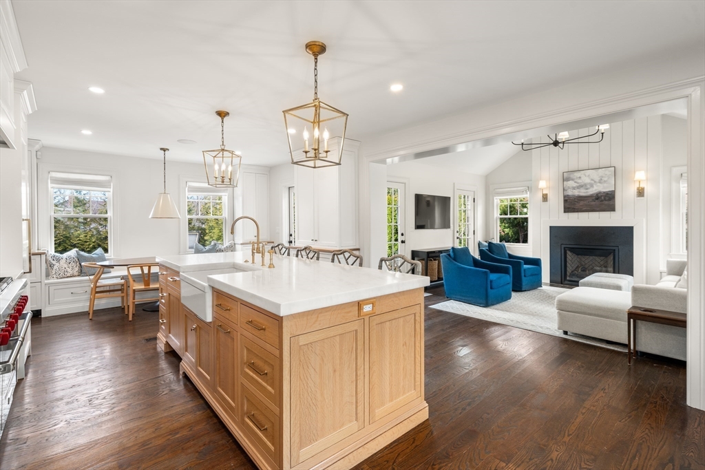 3 Cleveland Road Brookline, MA 02445 - Photo 14 of 27 a large white kitchen with a large island in the center