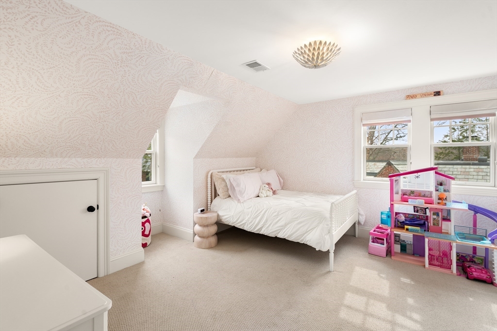 3 Cleveland Road Brookline, MA 02445 - Photo 15 of 27 a bedroom with furniture and a baby crib