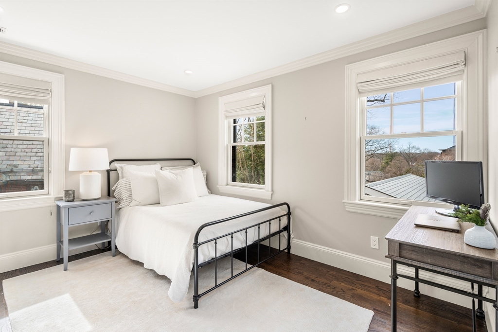 3 Cleveland Road Brookline, MA 02445 - Photo 20 of 27 a bedroom with a bed table and window