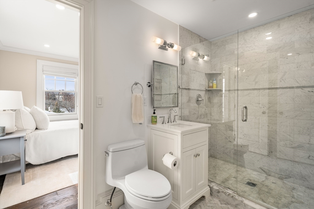 3 Cleveland Road Brookline, MA 02445 - Photo 21 of 27 a bathroom with a toilet a sink a shower and mirror